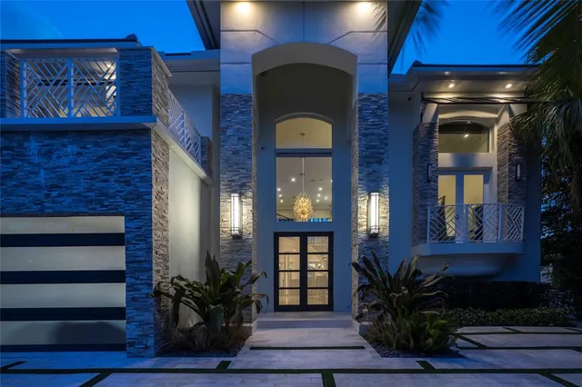 a view of house with swimming pool and outdoor seating
