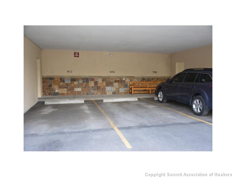 88 Guller Road, Unit 406 Frisco, CO 80443 - Photo 22 of 25 Parking Lot/Garage. Assigned covered parking beneath the building.