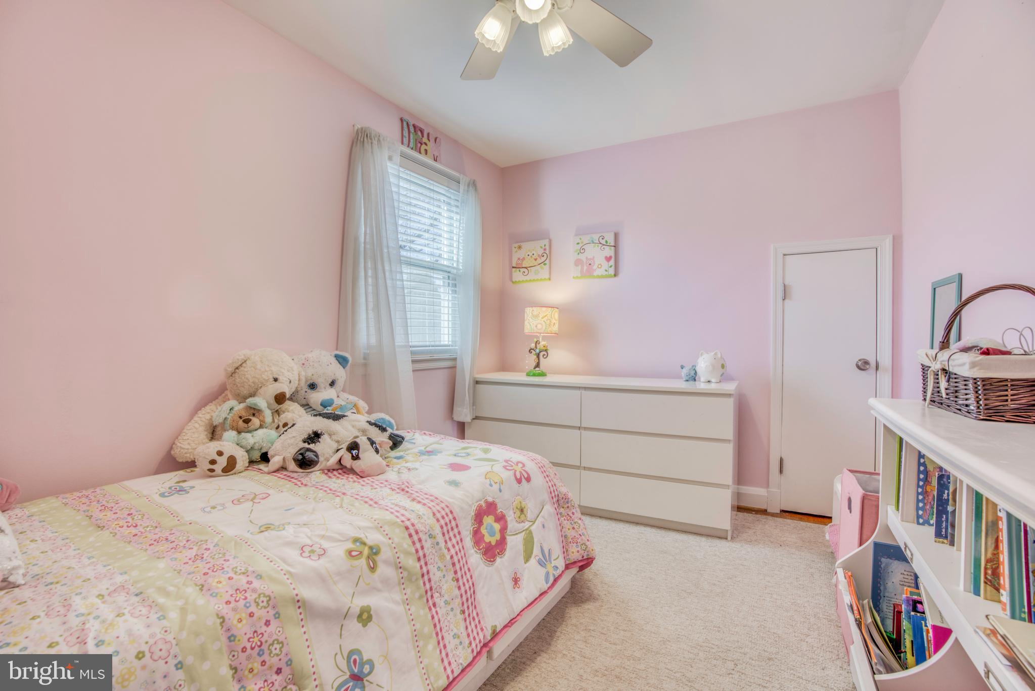 1305 Glendale Road Baltimore, MD 21239 - Photo 31 of 49 a bedroom with a bed and a chandelier