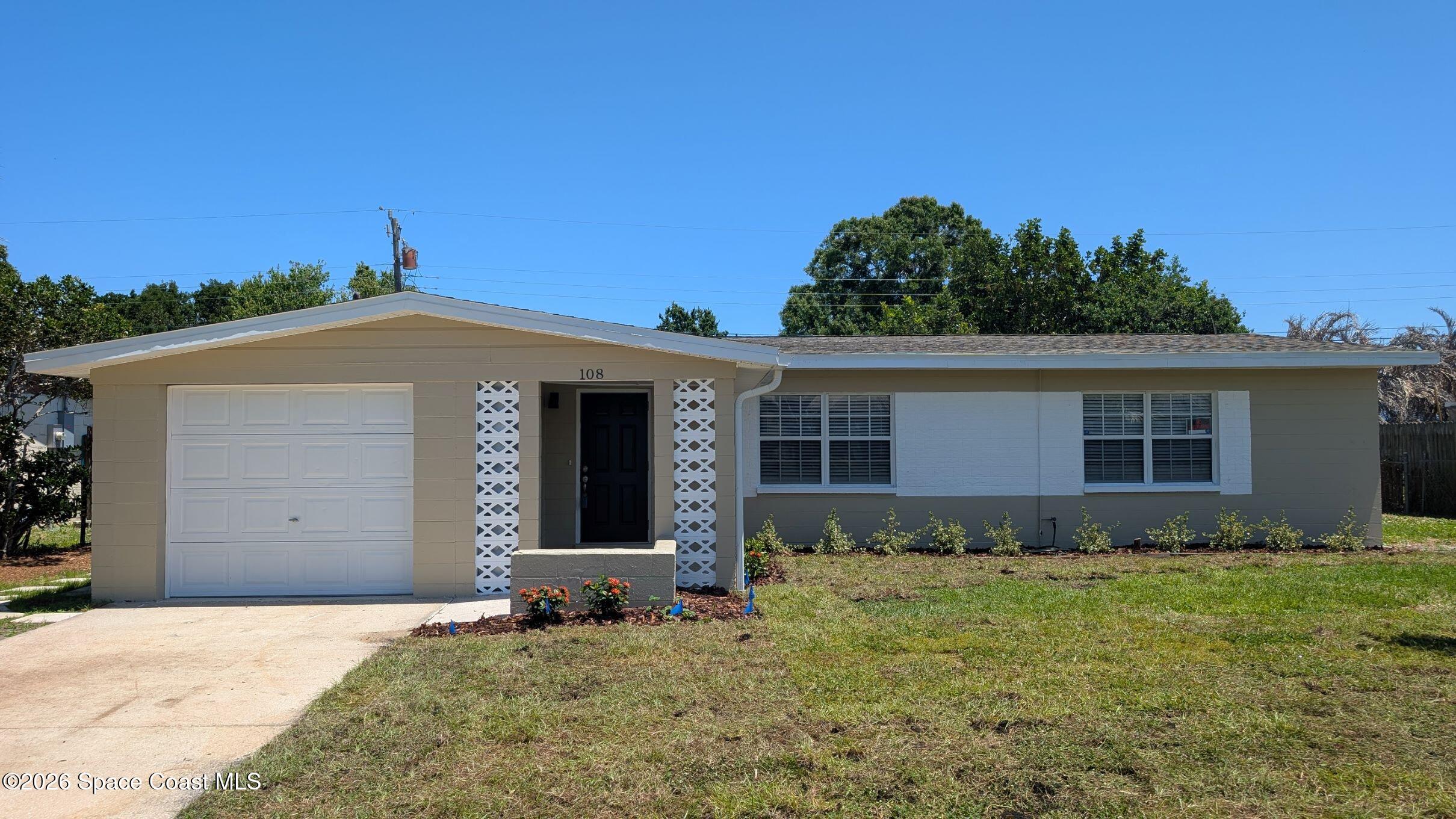 108 1st Street Merritt Island, FL 32953 - Photo 1 of 40 front view of a house with a yard