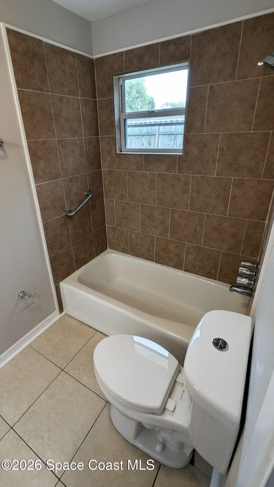108 1st Street Merritt Island, FL 32953 - Photo 20 of 40 a bathroom with a sink a toilet and shower