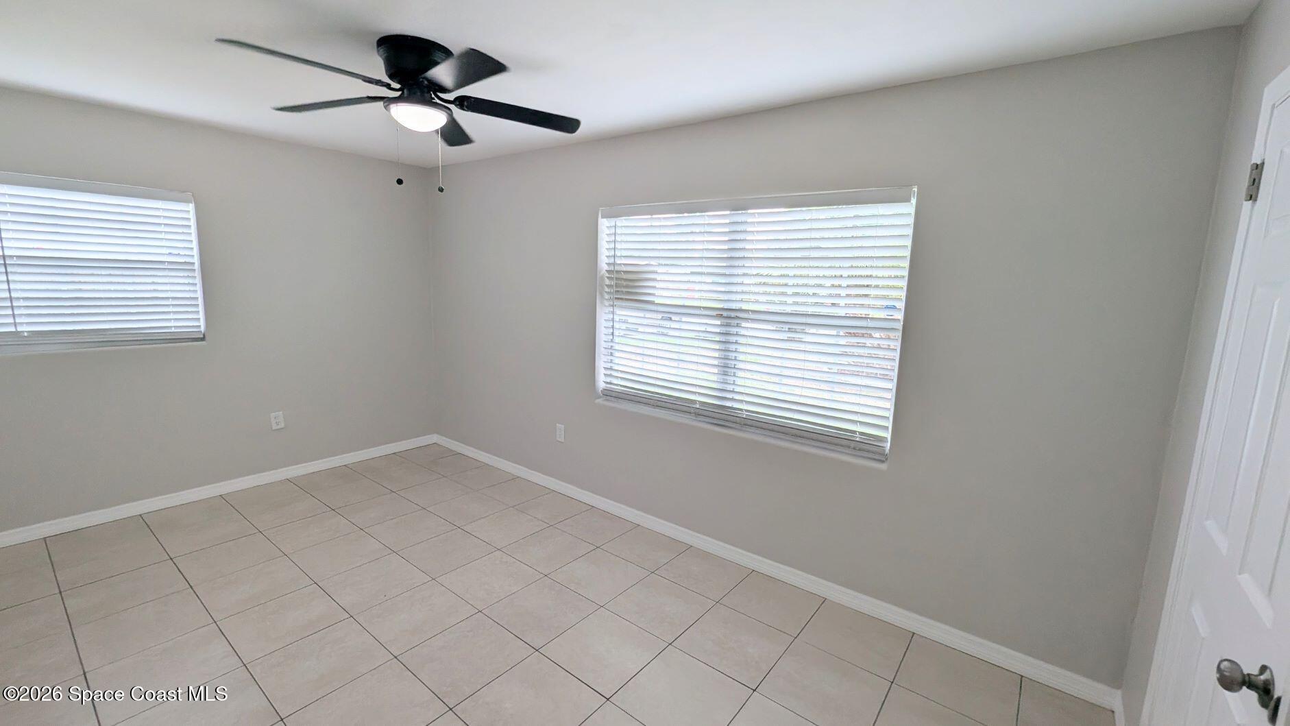 108 1st Street Merritt Island, FL 32953 - Photo 23 of 40 a view of an empty room with a window