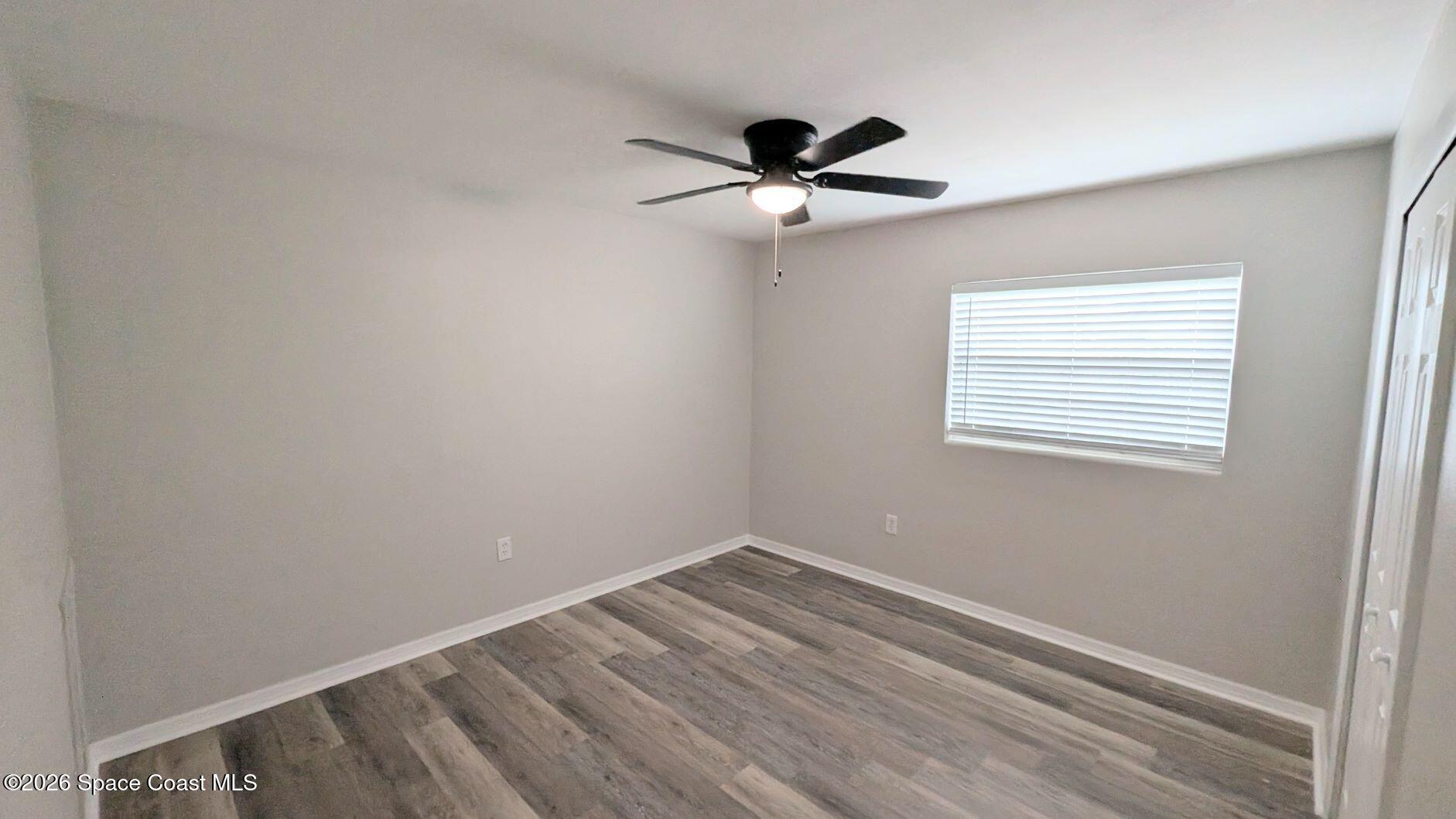 108 1st Street Merritt Island, FL 32953 - Photo 25 of 40 a view of empty room with wooden floor