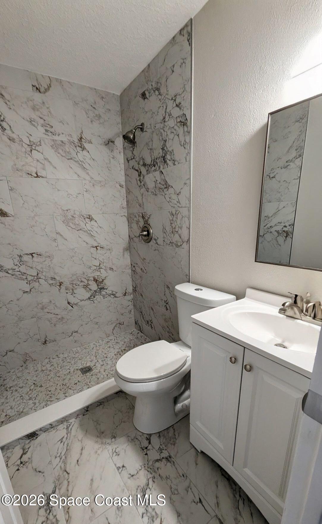 108 1st Street Merritt Island, FL 32953 - Photo 26 of 40 a bathroom with a sink toilet and shower