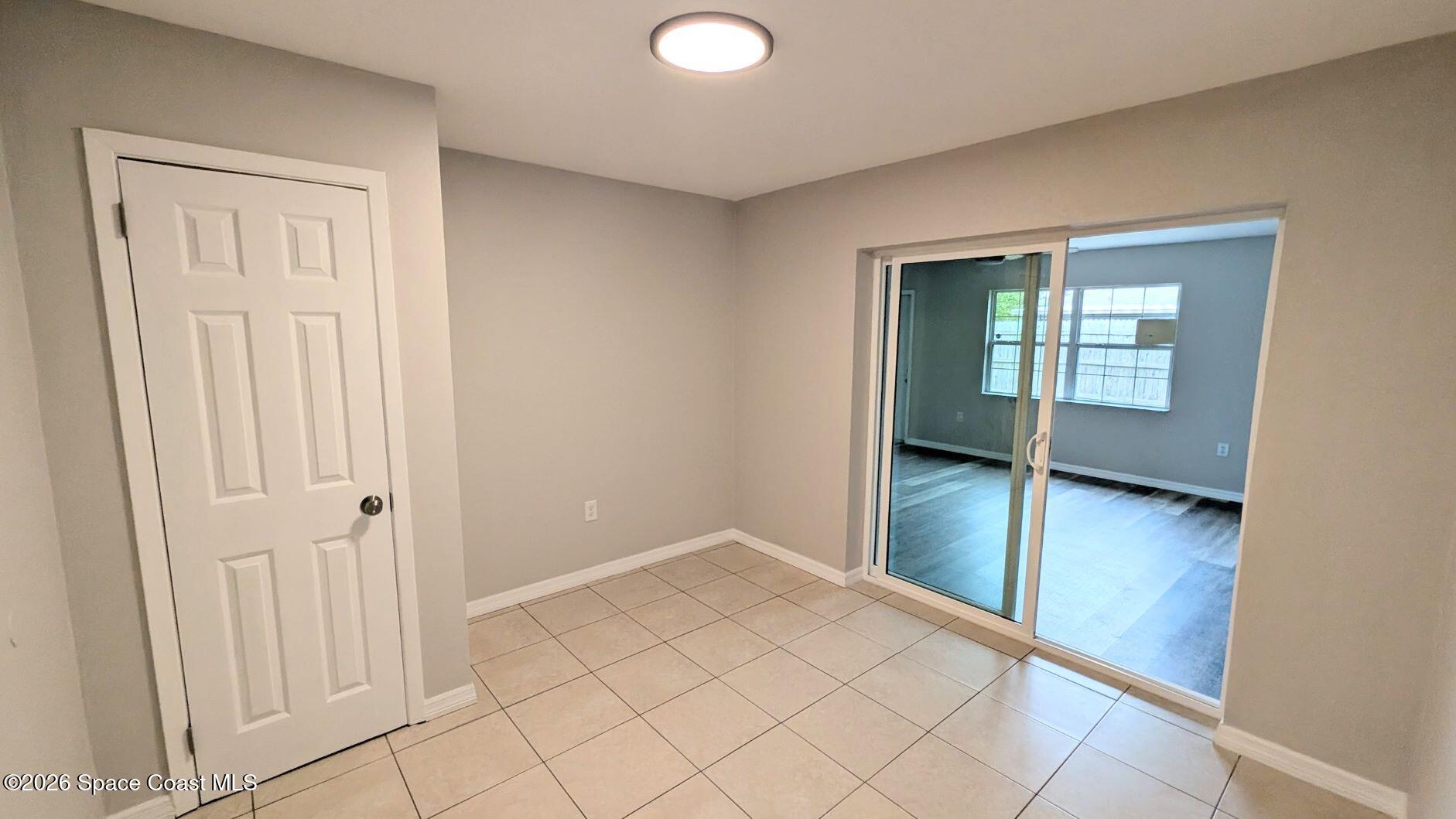 108 1st Street Merritt Island, FL 32953 - Photo 28 of 40 an empty room with windows