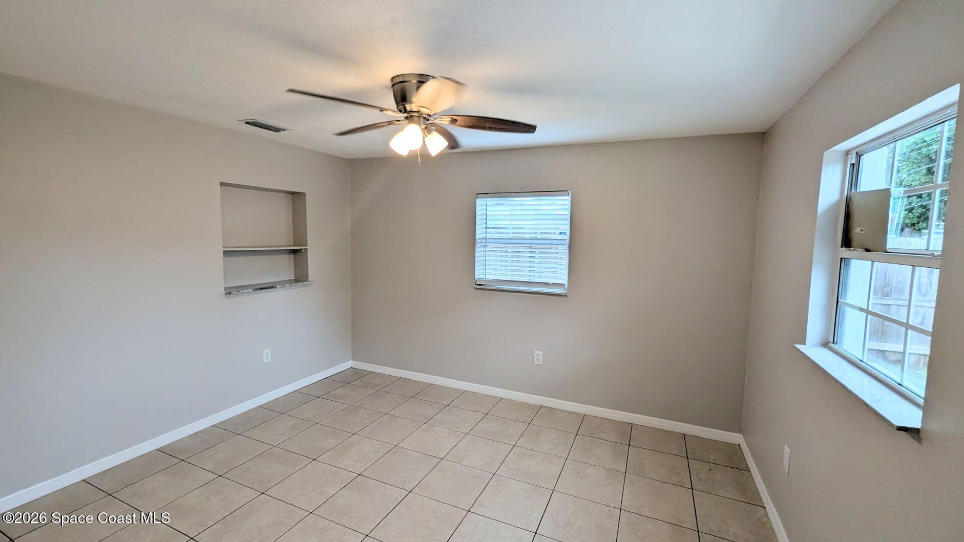 108 1st Street Merritt Island, FL 32953 - Photo 29 of 40 a view of an empty room with a window