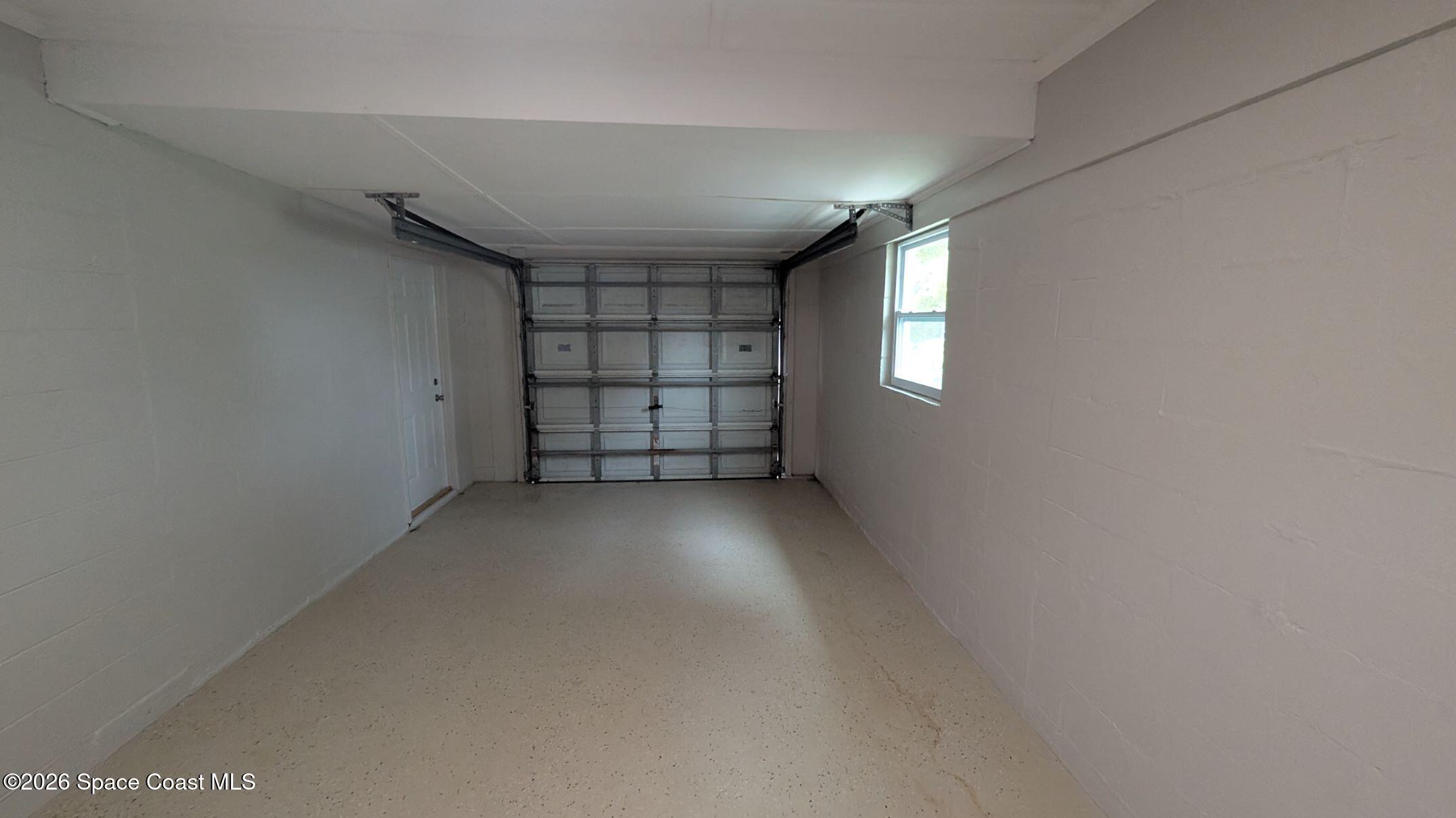 108 1st Street Merritt Island, FL 32953 - Photo 32 of 40 an empty room with windows