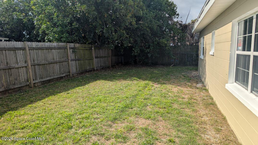108 1st Street Merritt Island, FL 32953 - Photo 33 of 40 a view of a backyard with wooden fence