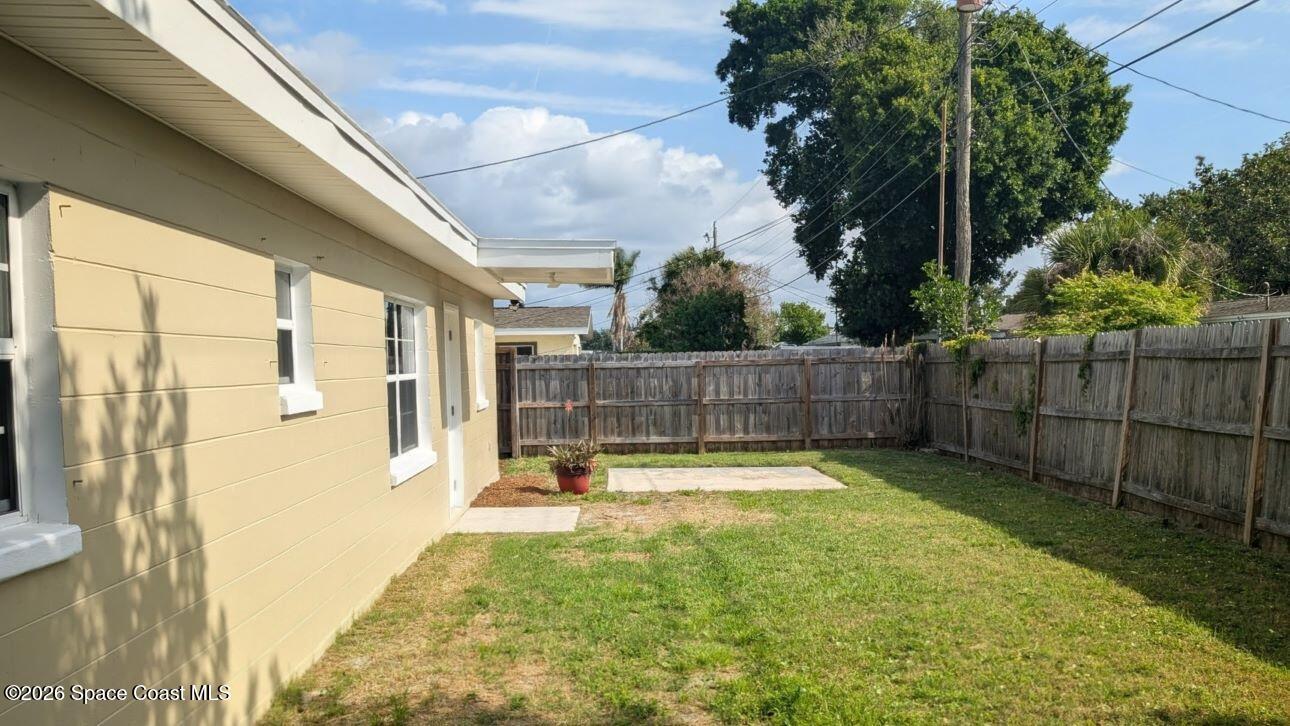 108 1st Street Merritt Island, FL 32953 - Photo 34 of 40 a view of outdoor space with deck and a garden