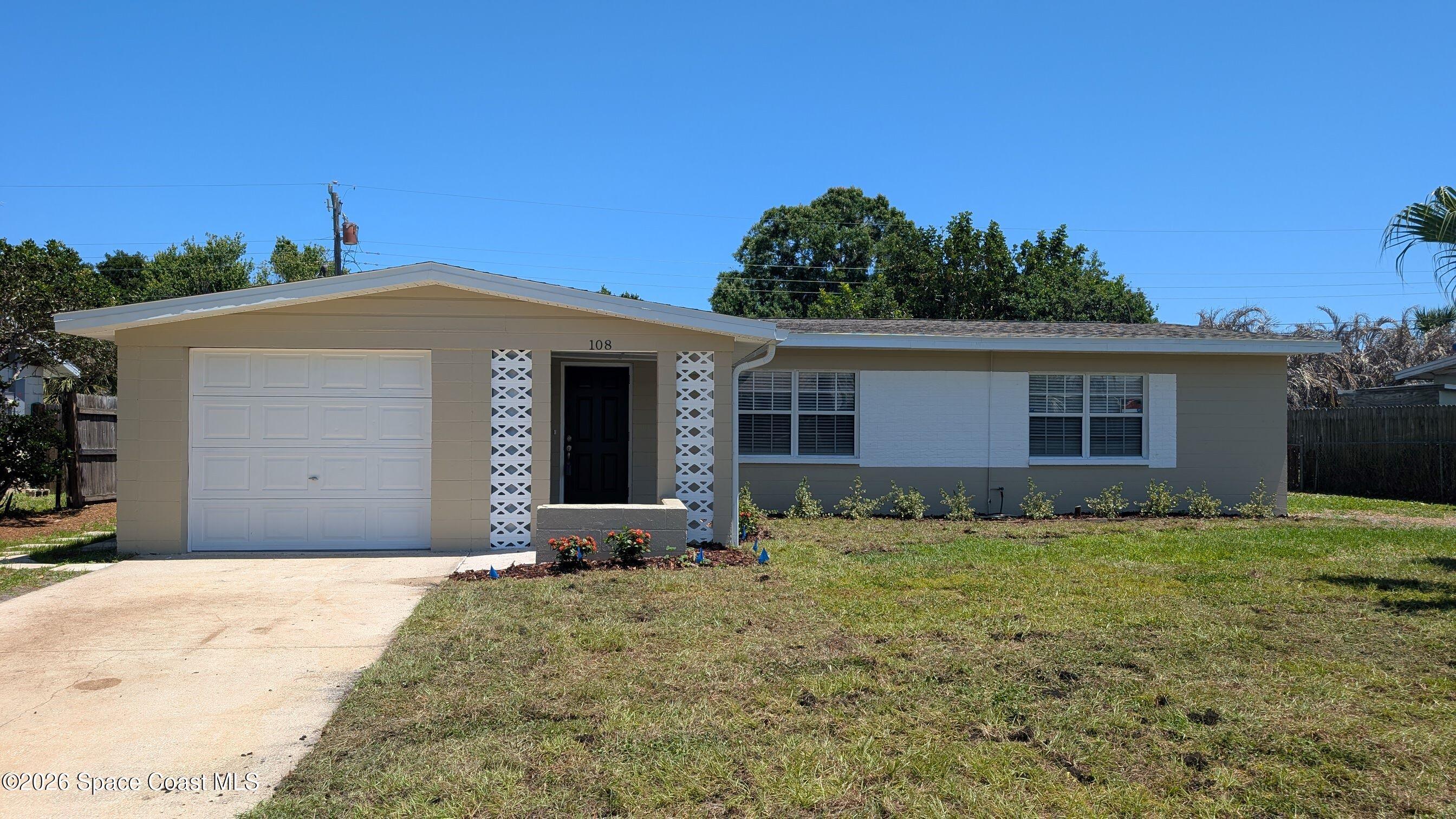 108 1st Street Merritt Island, FL 32953 - Photo 38 of 40 a front view of a house with a yard