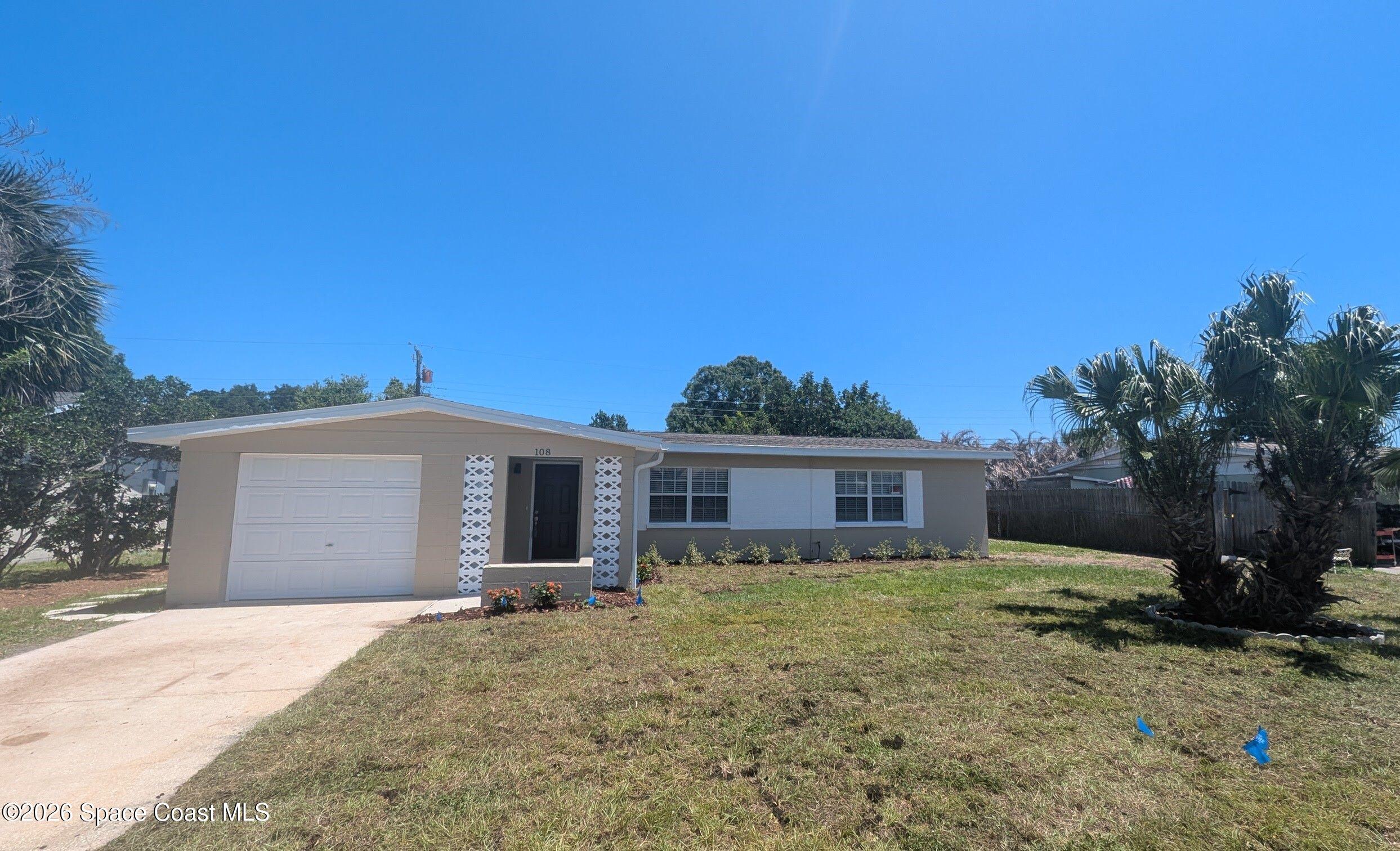 108 1st Street Merritt Island, FL 32953 - Photo 39 of 40 a view of a house with a yard