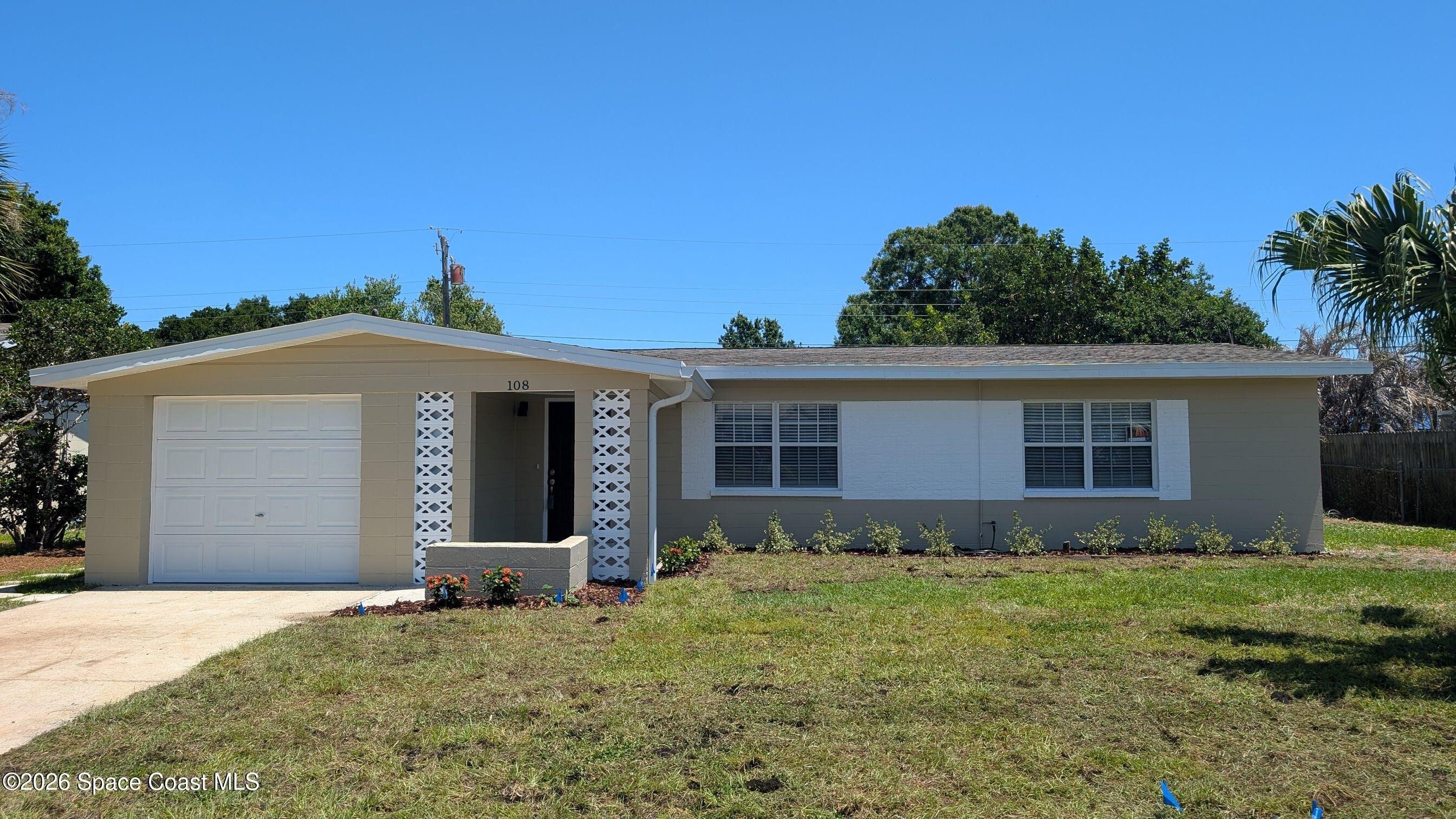 108 1st Street Merritt Island, FL 32953 - Photo 4 of 40 front view of a house with a yard