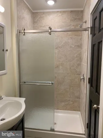 a bathroom with a sink and a shower