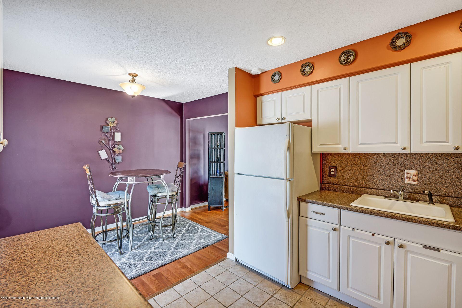 36 Mallard Road Bayville, NJ 08721 - Photo 14 of 28 a kitchen with cabinets a refrigerator and chairs
