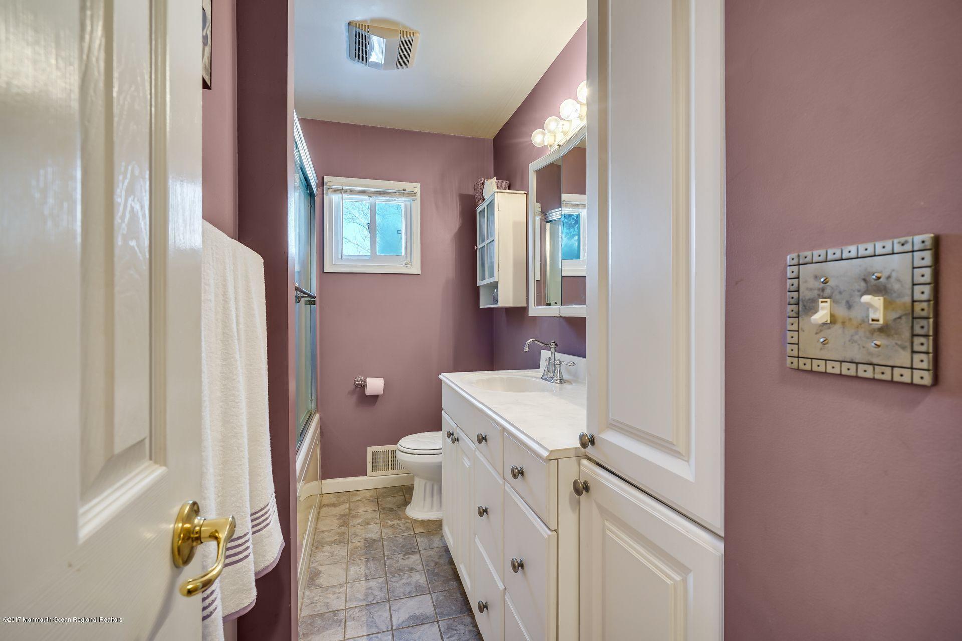 36 Mallard Road Bayville, NJ 08721 - Photo 15 of 28 a bathroom with a sink a toilet and a mirror