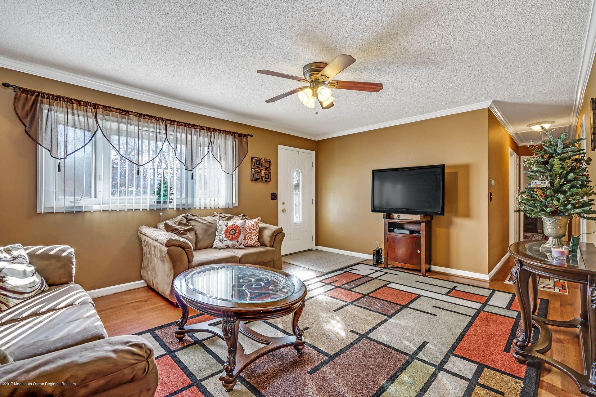 36 Mallard Road Bayville, NJ 08721 - Photo 6 of 28 a living room with furniture and a flat screen tv