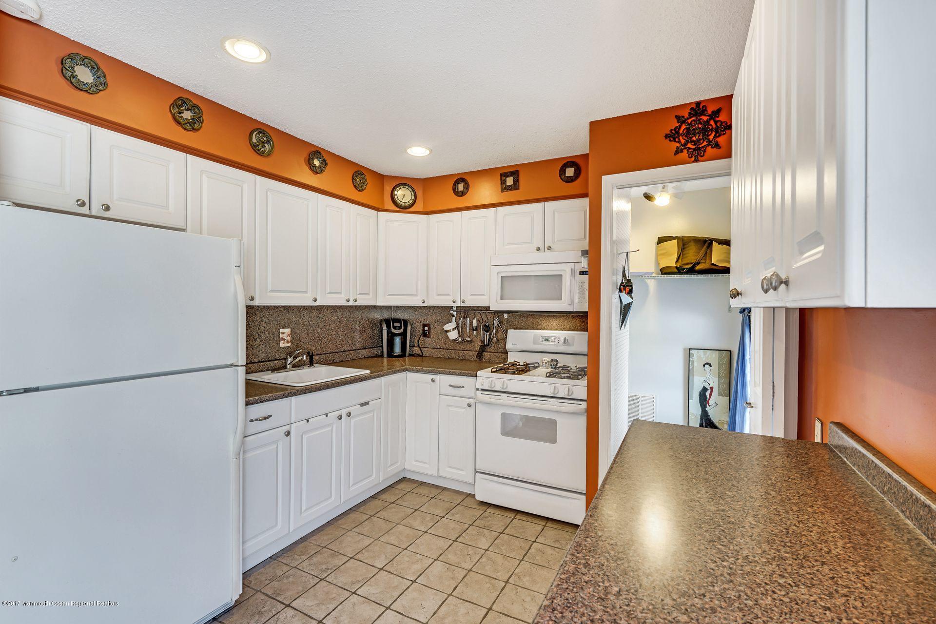 36 Mallard Road Bayville, NJ 08721 - Photo 10 of 28 a kitchen with stainless steel appliances a refrigerator sink and cabinets