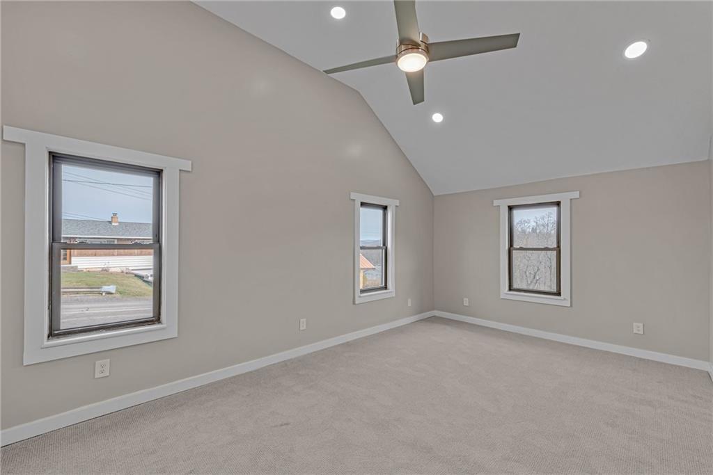 201 Grazier Street Johnstown, PA 15905 - Photo 15 of 25 an empty room with windows and ceiling fan