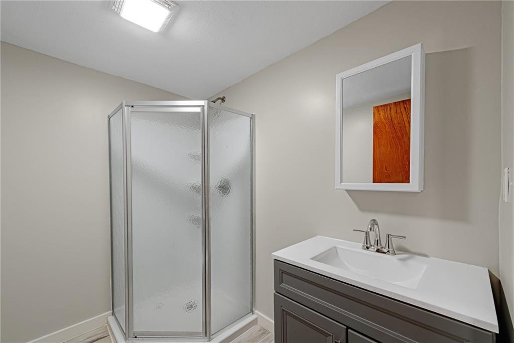 201 Grazier Street Johnstown, PA 15905 - Photo 17 of 25 a bathroom with a sink and a mirror