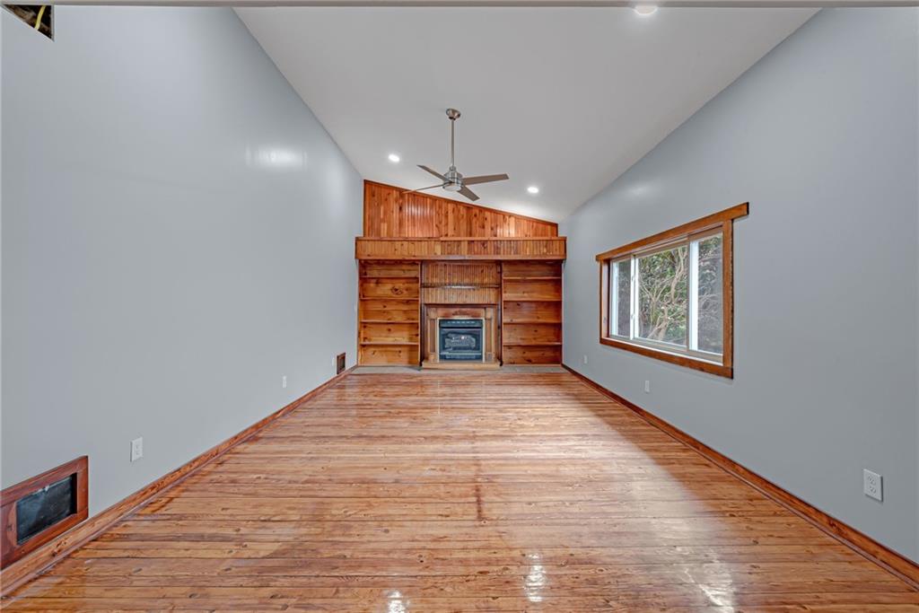 201 Grazier Street Johnstown, PA 15905 - Photo 19 of 25 a big room with wooden floor fireplace and windows