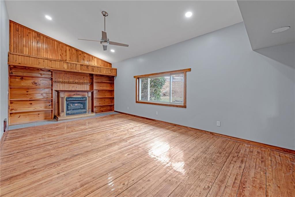 201 Grazier Street Johnstown, PA 15905 - Photo 20 of 25 an empty room with wooden floor fireplace and window