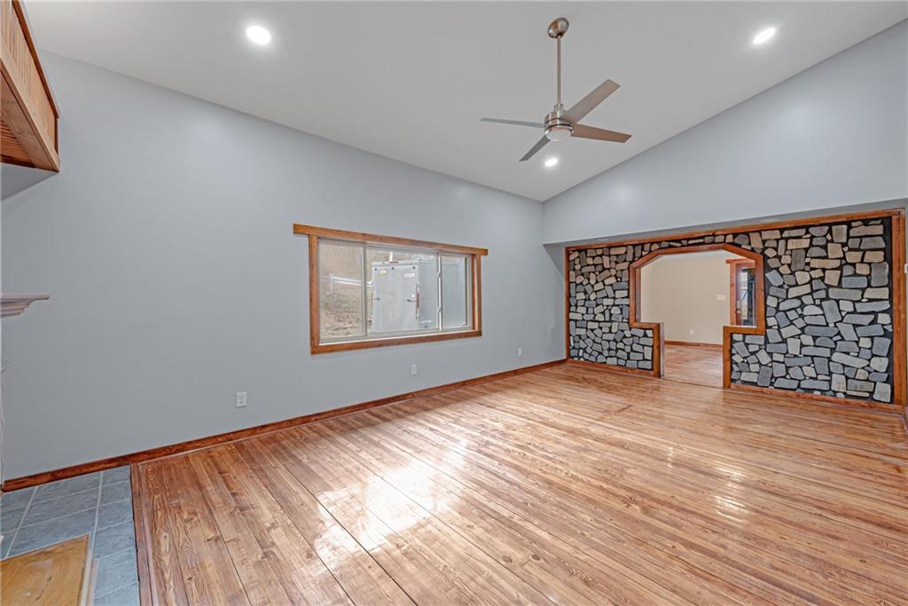 201 Grazier Street Johnstown, PA 15905 - Photo 21 of 25 a view of an empty room with a window and wooden floor