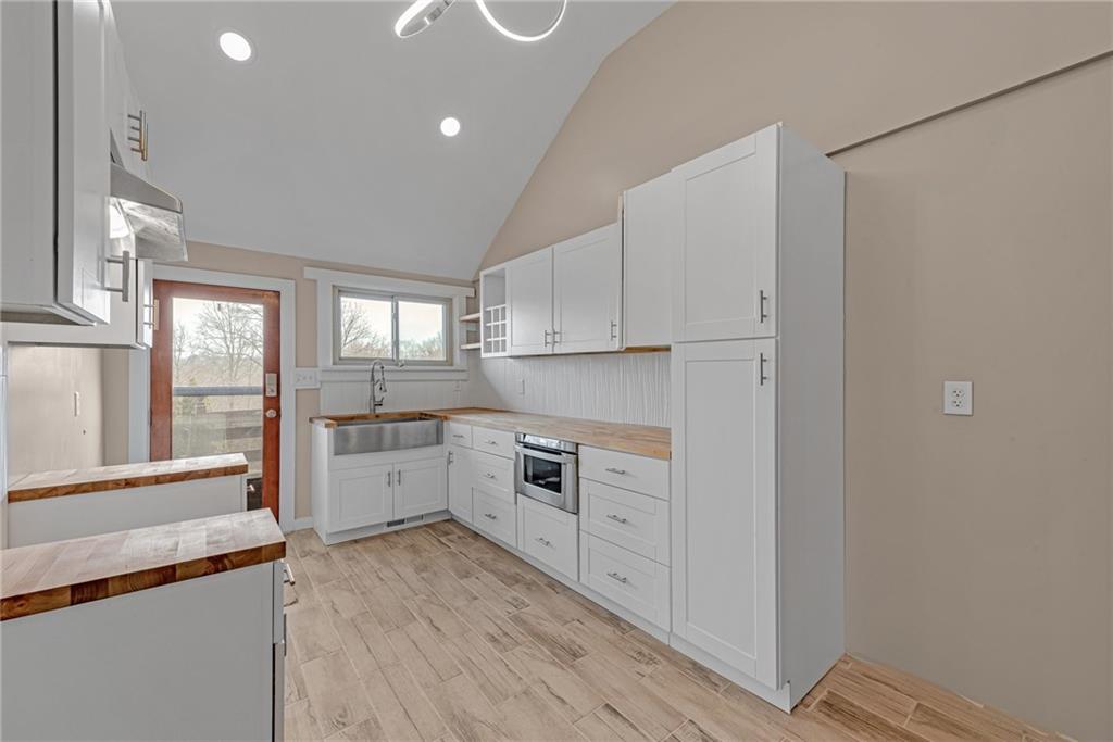 201 Grazier Street Johnstown, PA 15905 - Photo 7 of 25 a kitchen with white cabinets and white appliances