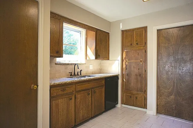 a kitchen with stainless steel appliances granite countertop a stove and a refrigerator