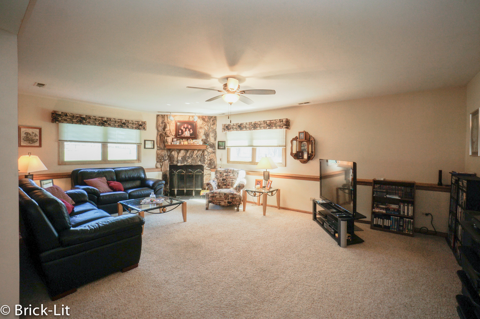 19227 Weber Road Mokena, IL 60448 - Photo 11 of 19 a living room with furniture a fireplace and a large window