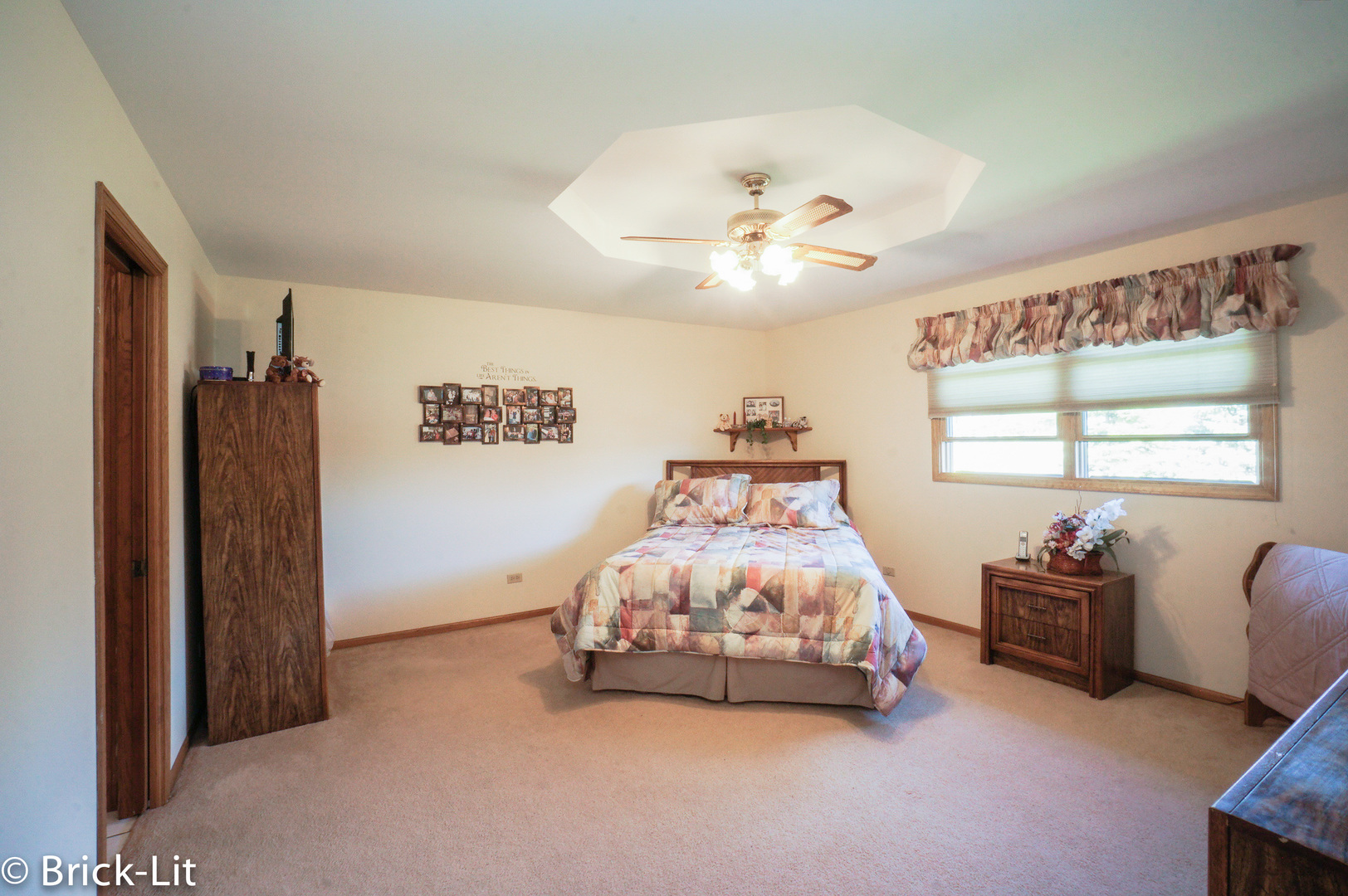 19227 Weber Road Mokena, IL 60448 - Photo 14 of 19 a bedroom with a bed and a chandelier
