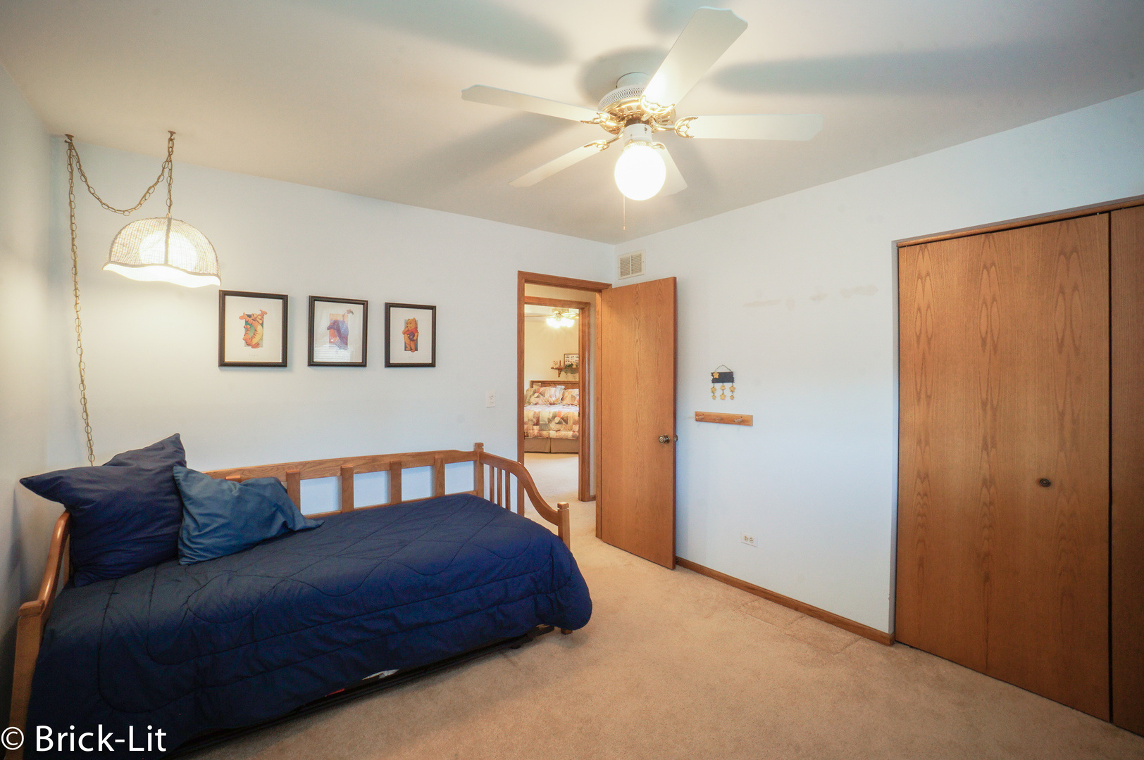 19227 Weber Road Mokena, IL 60448 - Photo 17 of 19 a spacious bedroom with a bed and a chandelier