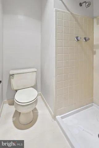 a view of an empty room and wooden floor