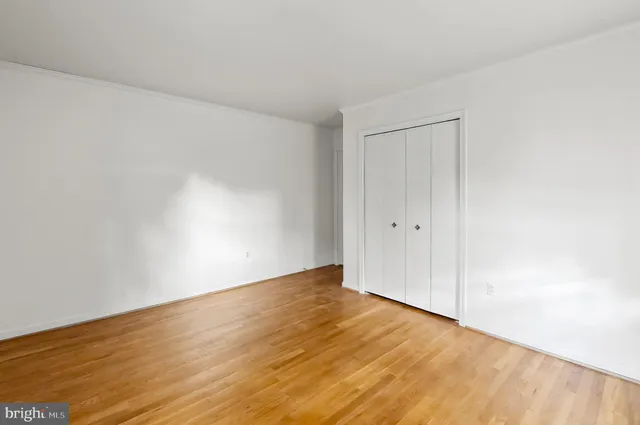 a view of an empty room with wooden walls