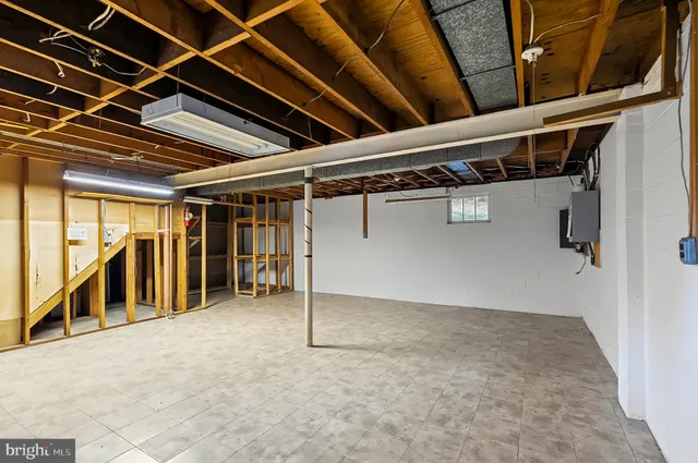 a bedroom with a bed and flat screen tv