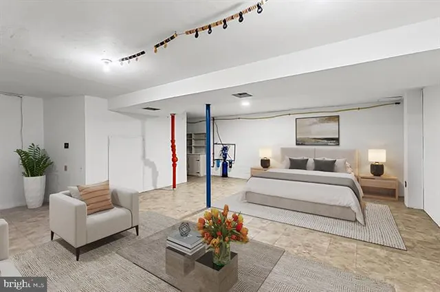 a view of a house with a yard and large tree