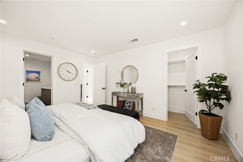905 Sunset Boulevard, Unit A Arcadia, CA 91007 - Photo 17 of 35 a bedroom with a bed and a chandelier