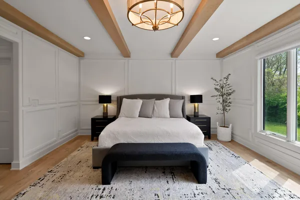 a living room with furniture and a dresser