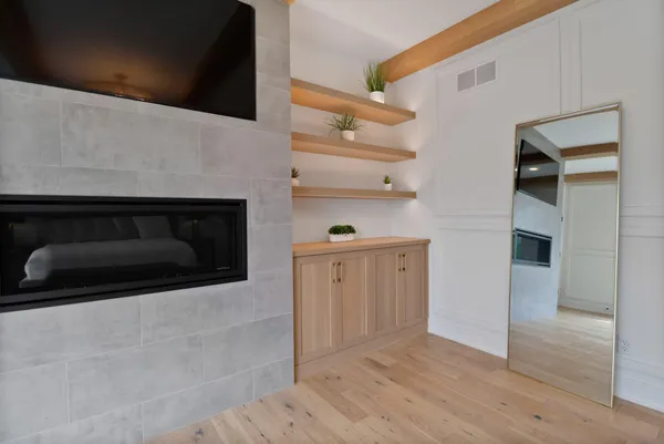a bathroom with a sink toilet vanity and shower