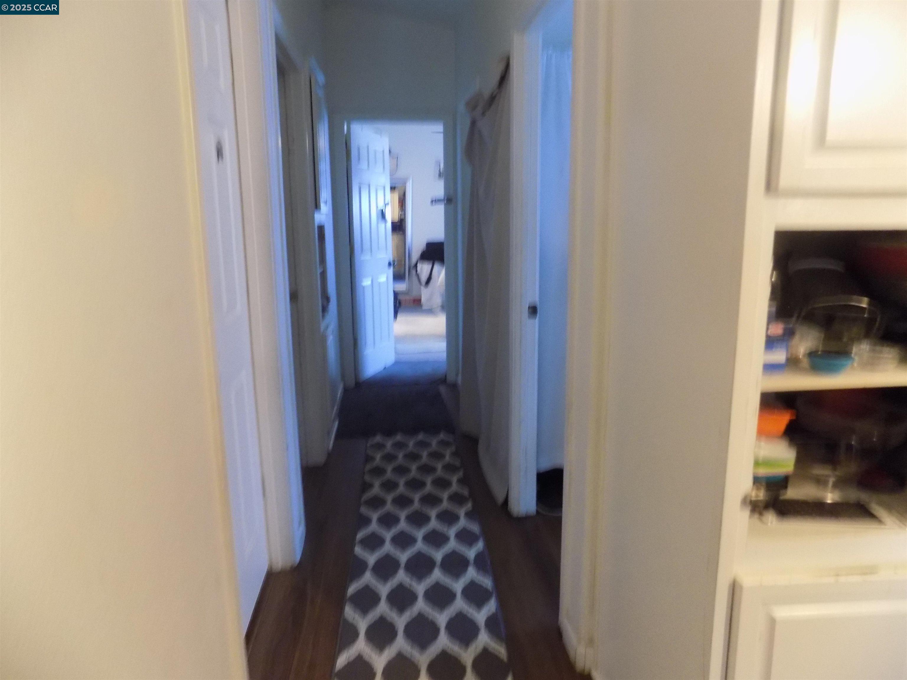 55 Pacifica Avenue, Unit 146 Bay Point, CA 94565 - Photo 11 of 18 a hallway with a dining table and chair