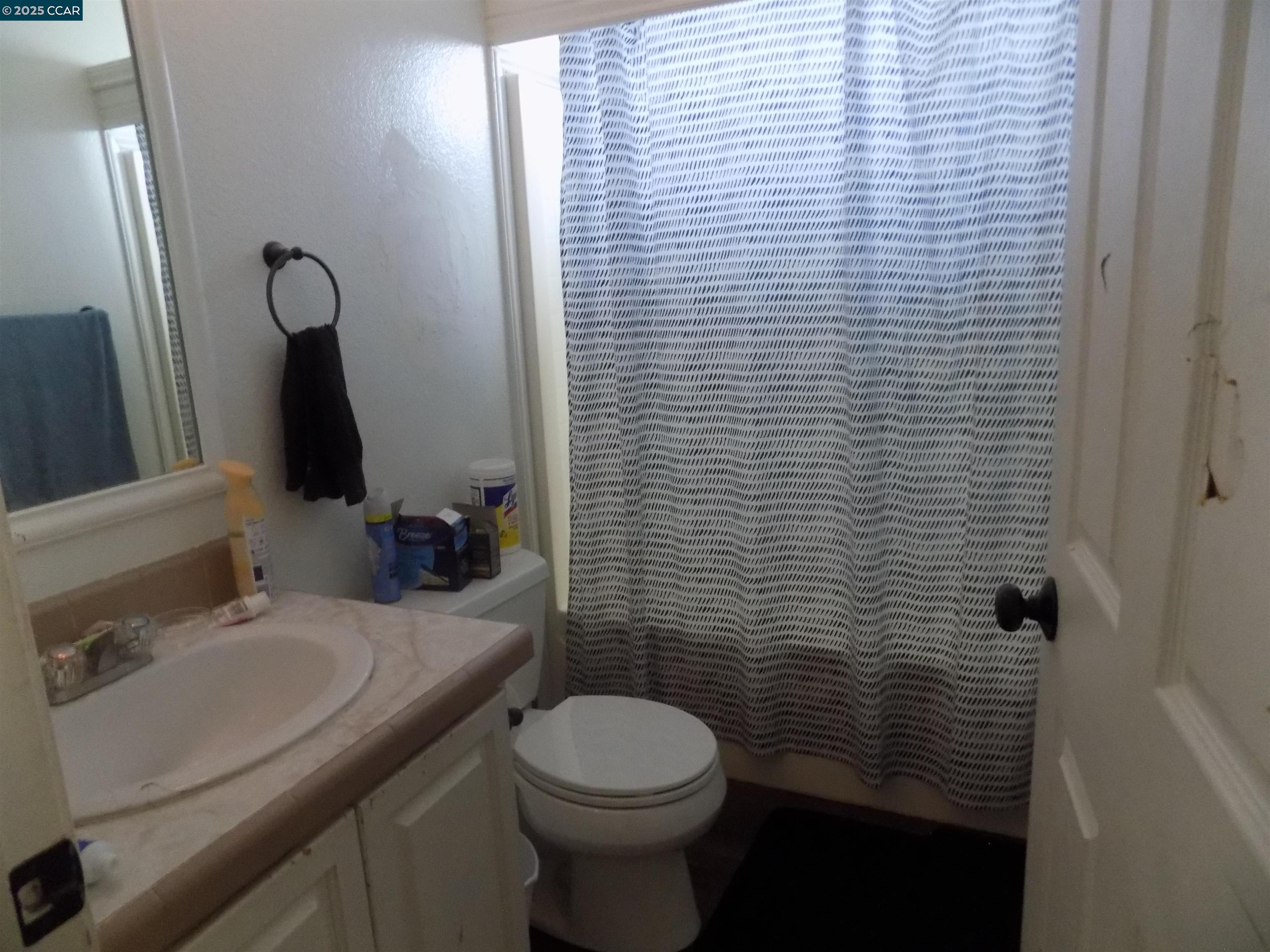 55 Pacifica Avenue, Unit 146 Bay Point, CA 94565 - Photo 13 of 18 a bathroom with a sink a toilet and shower