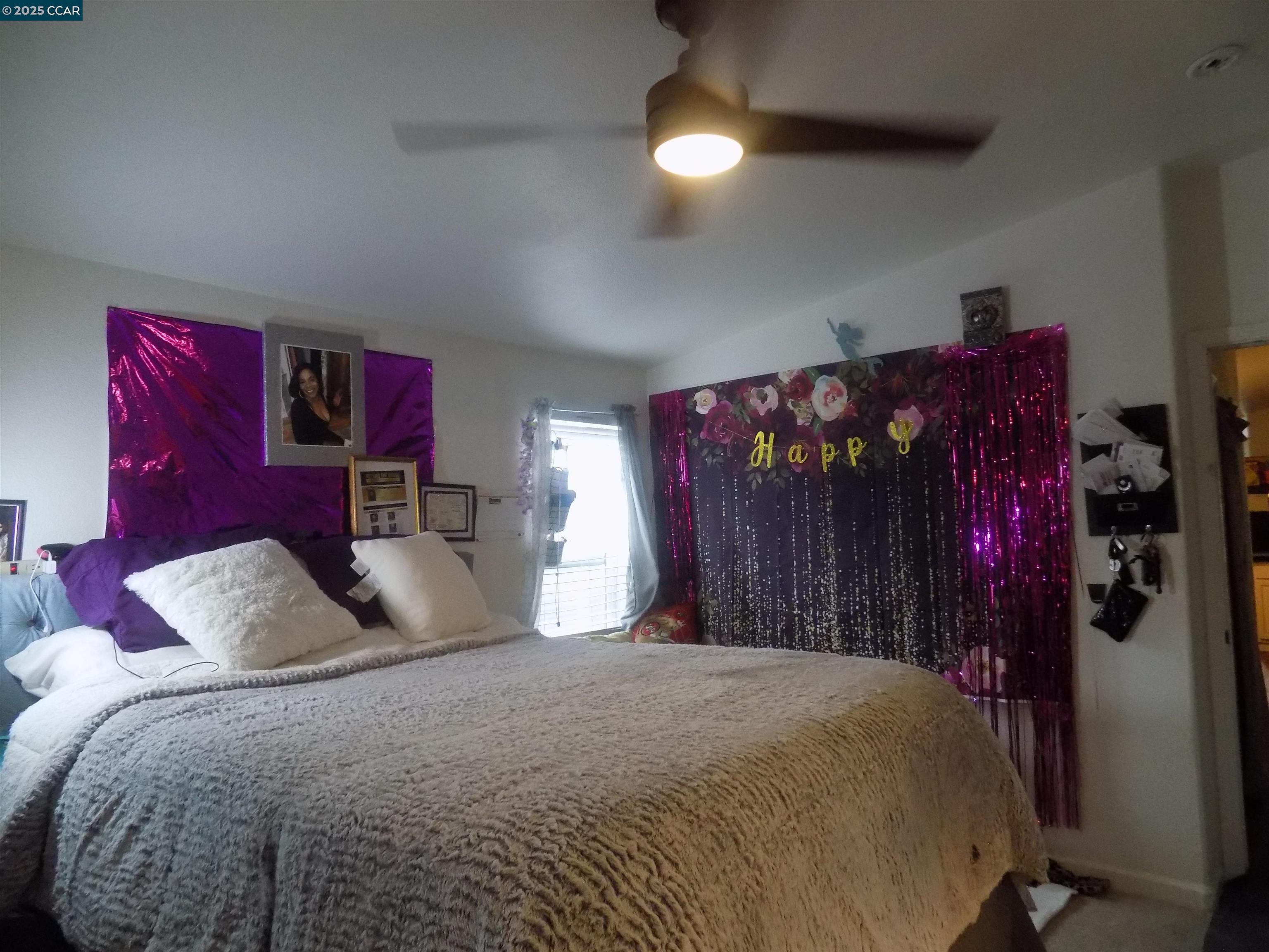 55 Pacifica Avenue, Unit 146 Bay Point, CA 94565 - Photo 15 of 18 a bedroom with a bed and a chandelier