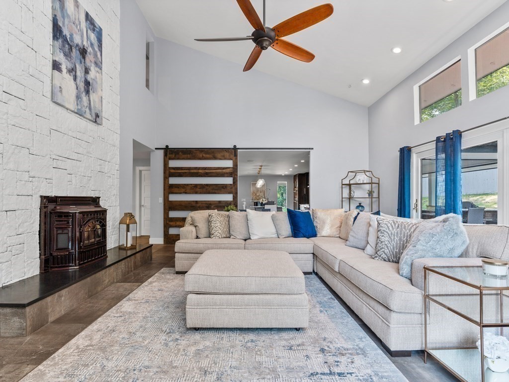 49 Reed Street Rehoboth, MA 02769 - Photo 11 of 40 a living room with furniture and a fireplace