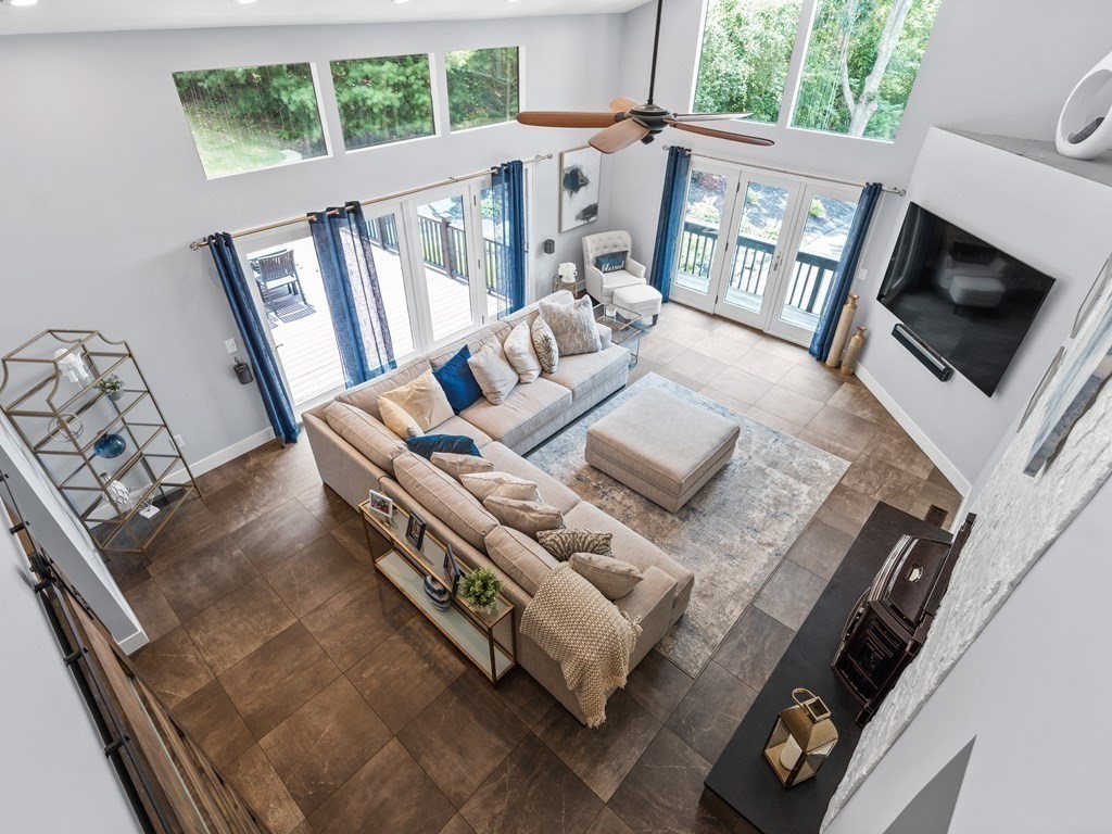 49 Reed Street Rehoboth, MA 02769 - Photo 12 of 40 a living room with furniture and a flat screen tv