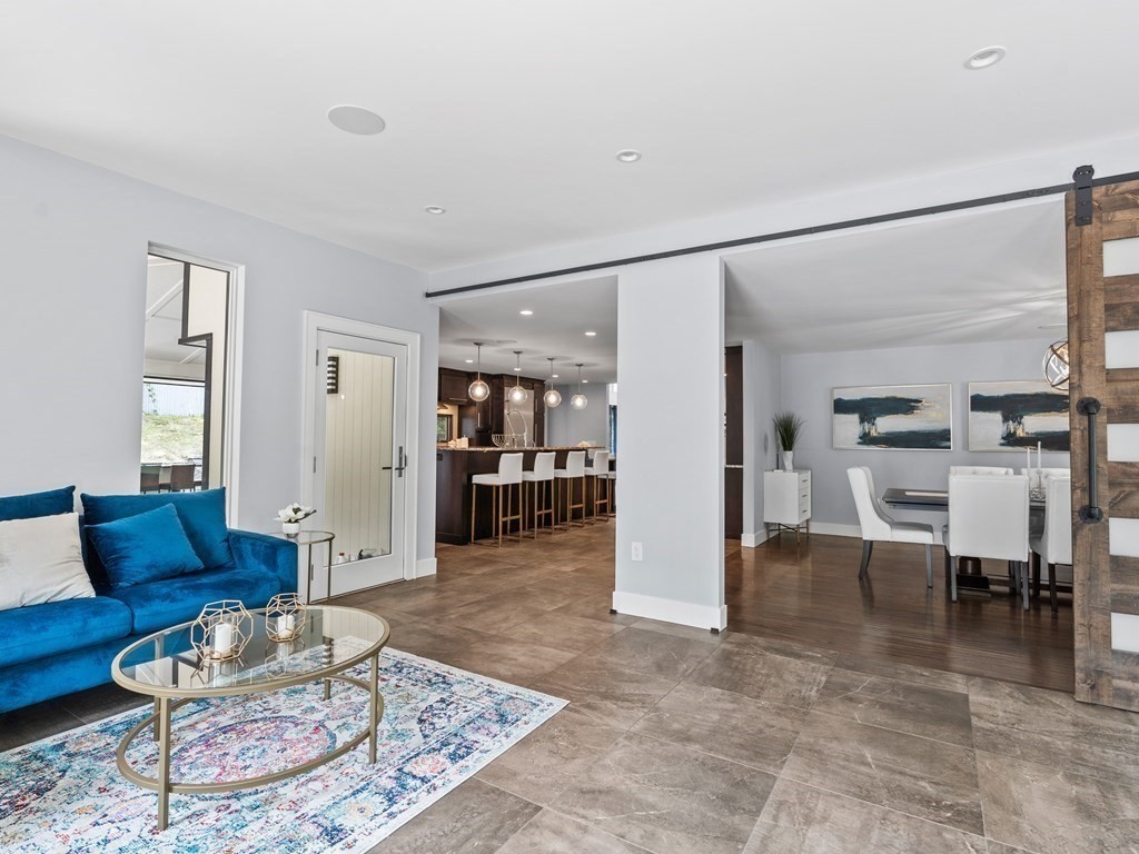 49 Reed Street Rehoboth, MA 02769 - Photo 14 of 40 a living room with furniture and a rug