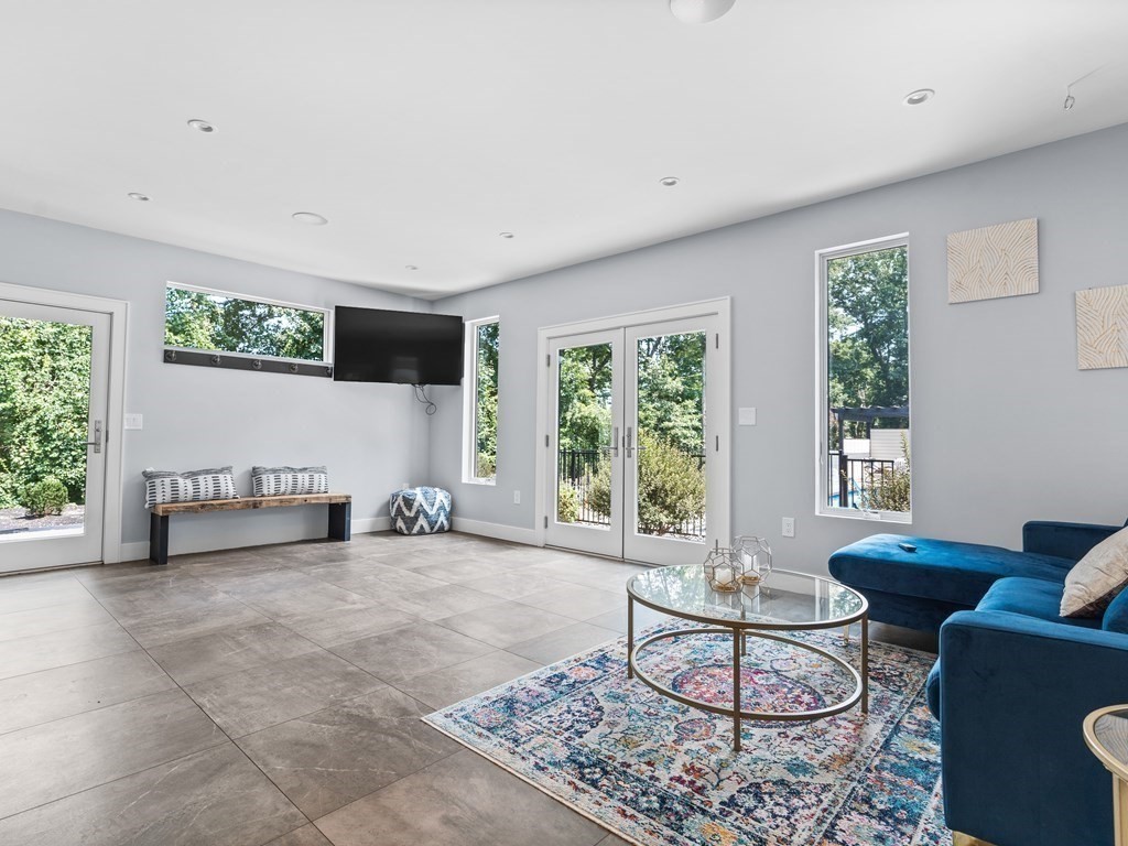 49 Reed Street Rehoboth, MA 02769 - Photo 15 of 40 a living room with furniture and a flat screen tv