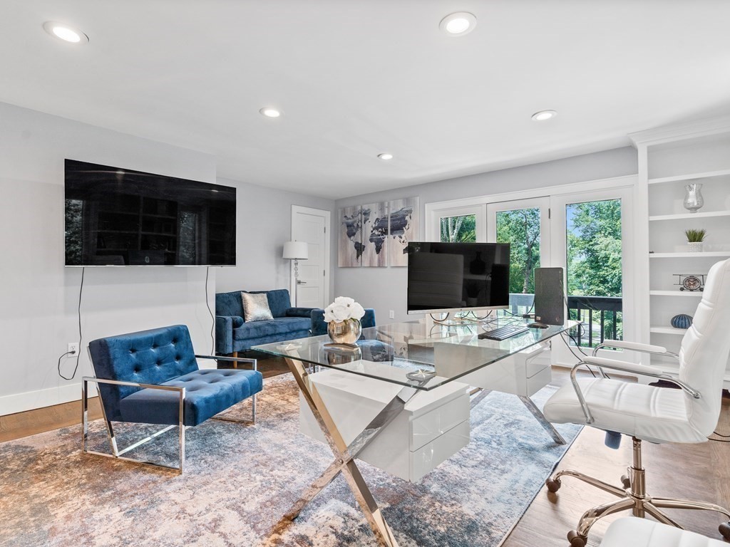 49 Reed Street Rehoboth, MA 02769 - Photo 19 of 40 a living room with furniture a flat screen tv and a large window