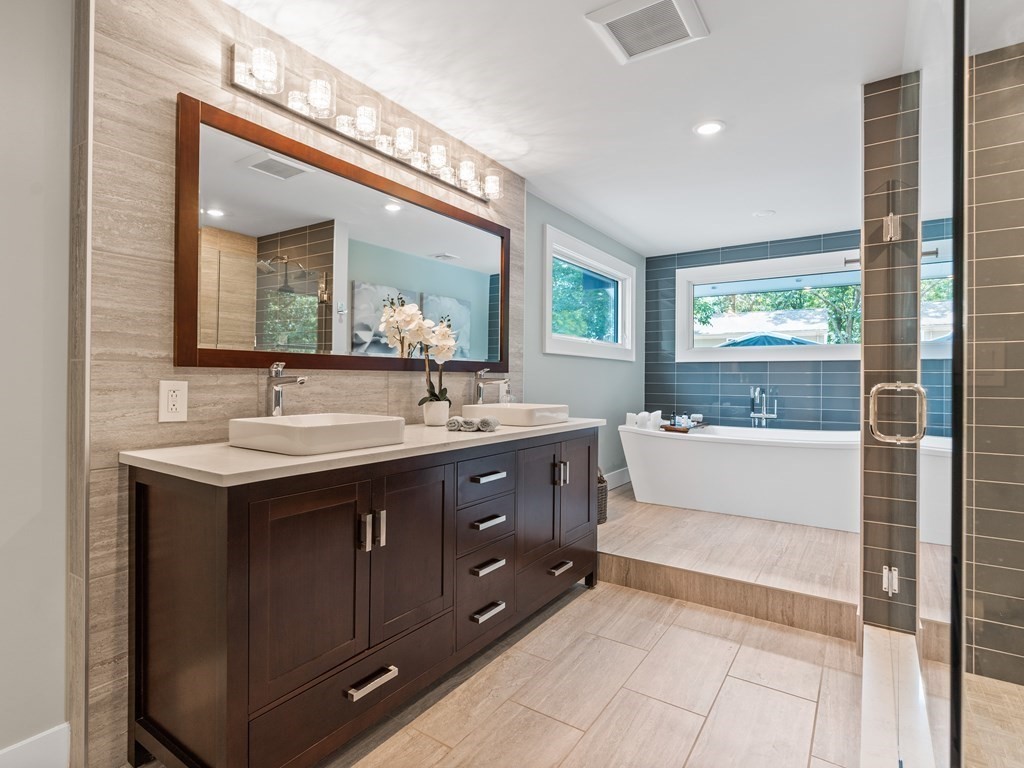 49 Reed Street Rehoboth, MA 02769 - Photo 26 of 40 a bathroom with a sink double vanity and a bathtub