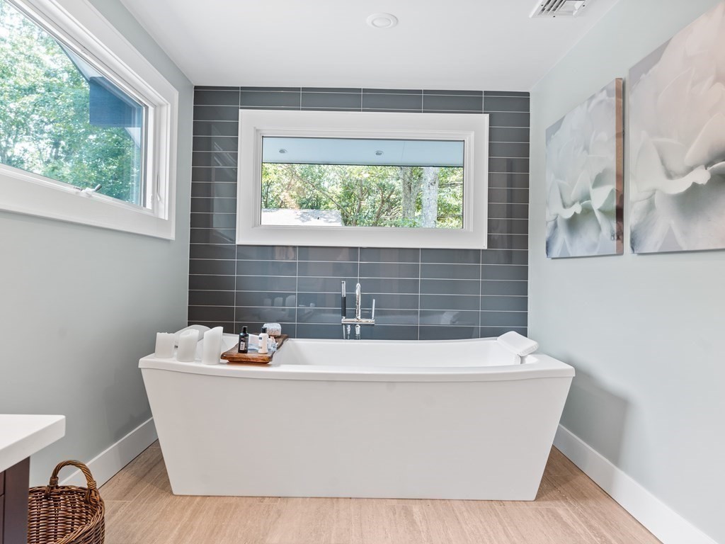 49 Reed Street Rehoboth, MA 02769 - Photo 27 of 40 a white bath tub sitting in a bathroom