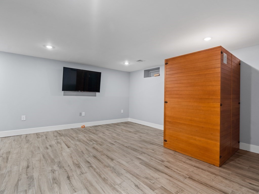 49 Reed Street Rehoboth, MA 02769 - Photo 30 of 40 an empty room with wooden floor and windows