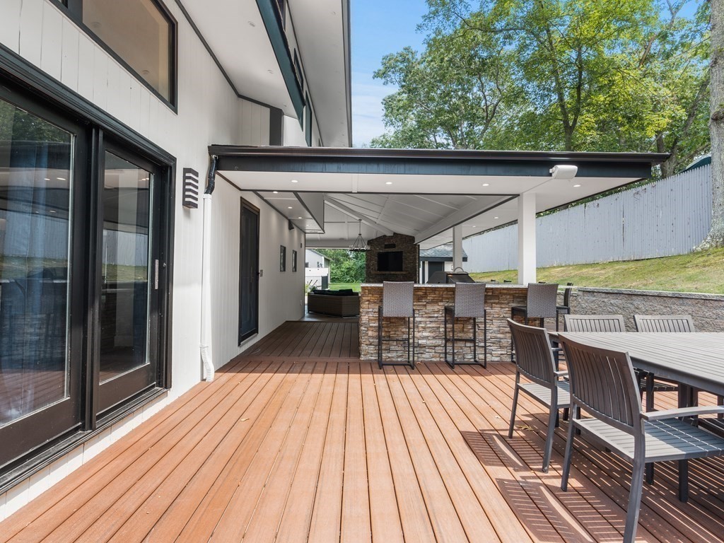 49 Reed Street Rehoboth, MA 02769 - Photo 31 of 40 a view of a patio with table and chairs wooden floor and fence